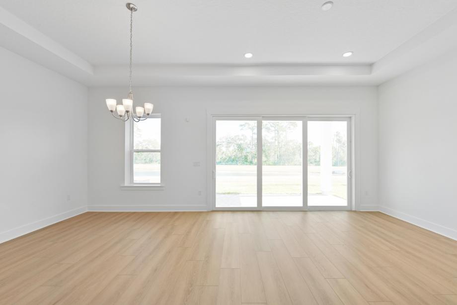 Great room with multi-sliding glass door connecting indoor-outdoor living