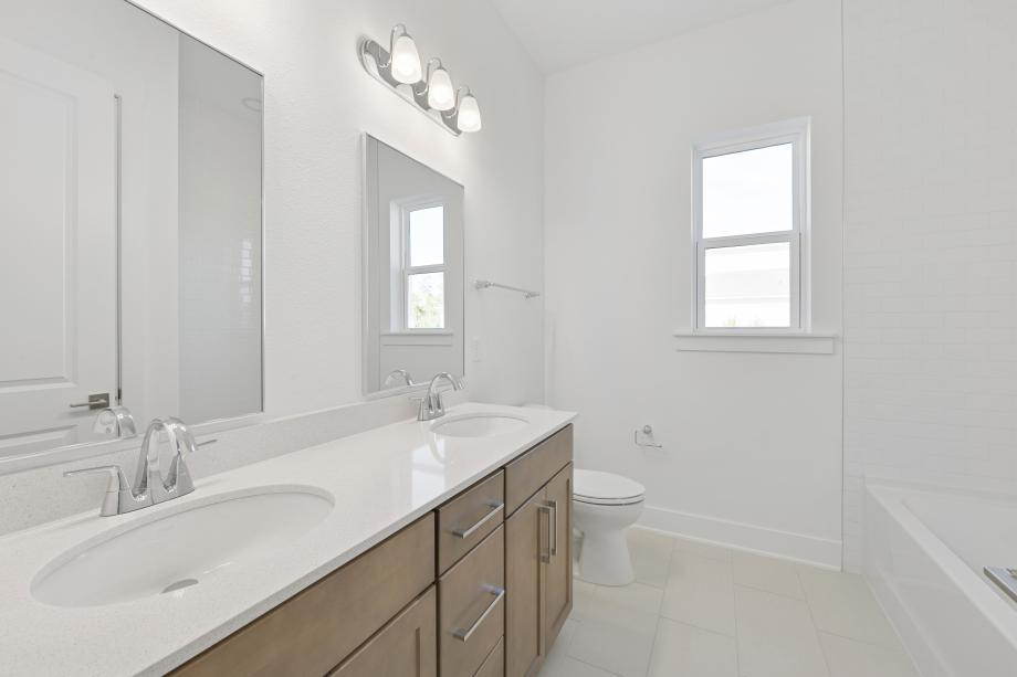 Secondary bathroom with a dual-sink vanity