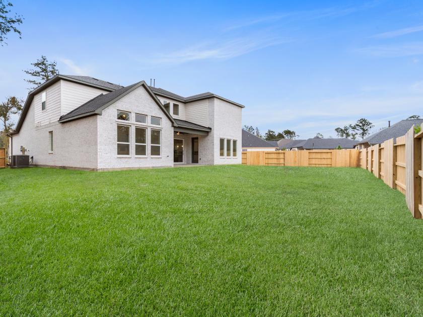 Expansive backyard with covered patio