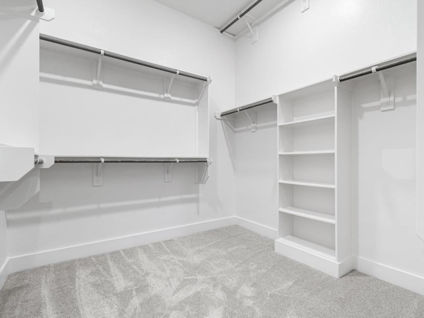 Spacious walk-in closet with ample storage space