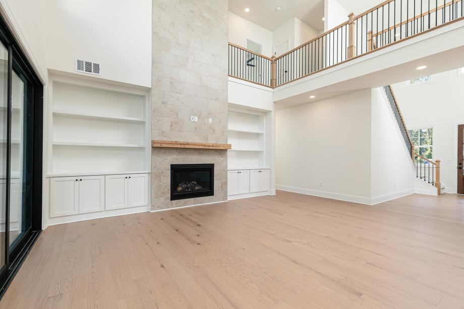 Soaring two-story great room offering an abundance of natural light