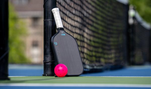 Play a round of pickleball with neighbors