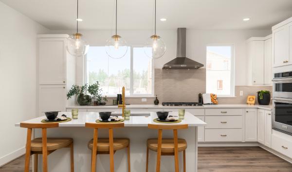 Kitchen features white shaker style cabinetry