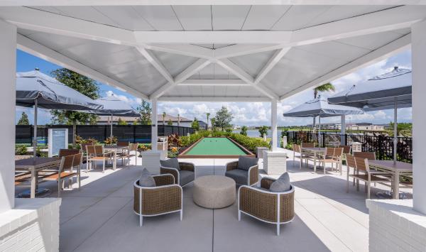 Take part in a game at the bocce ball court
