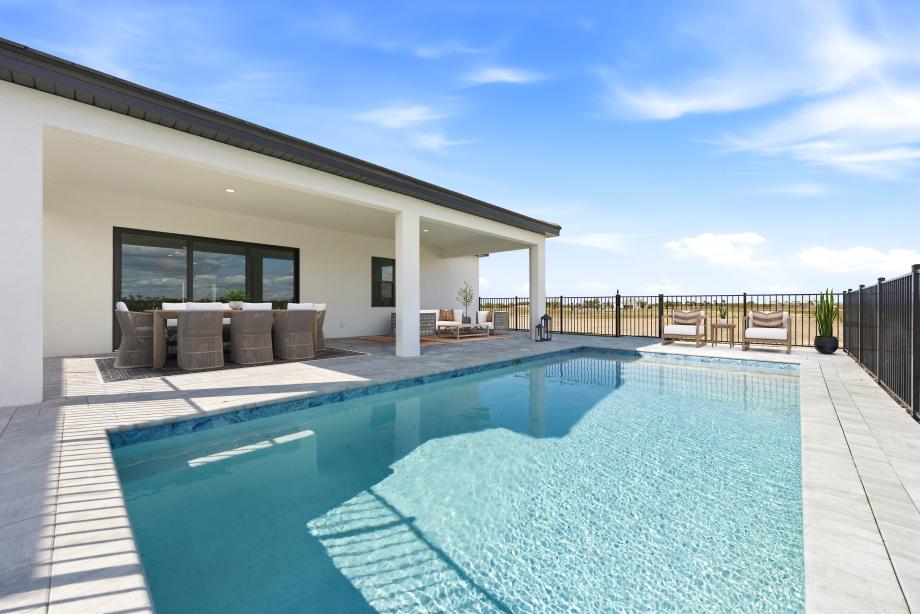 Enjoy the Florida sun under the spacious covered lanai or private pool