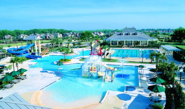 Waterparks with a beach entrance and a lap pool in the master plan community