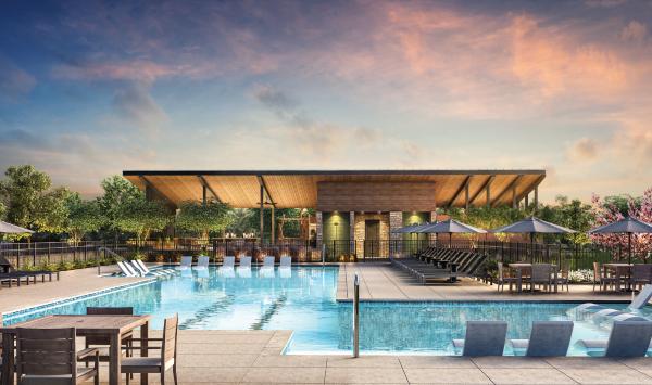 Resort-style pool with lounge chairs and cabanas