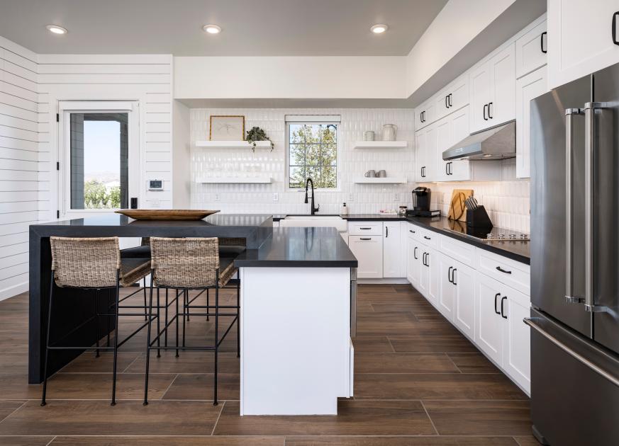 Well-appointed kitchen with center island and breakfast bar and premium KitchenAid appliances