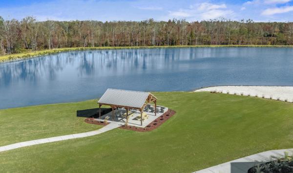 Relax and unwind at the community lake, pier, pavilion, and beach