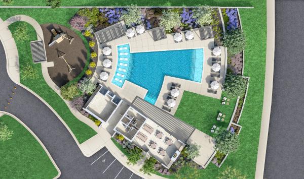 Amenity center featuring a resort-style pool, outdoor showers, covered gathering area, and playground