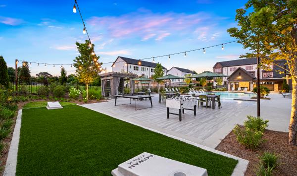 Socialize and play games with neighbors on the game lawn
