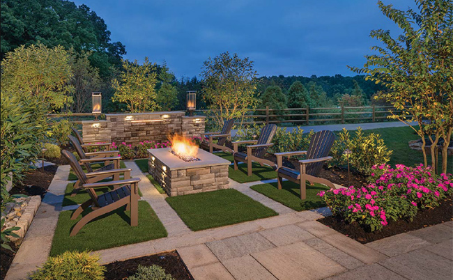 Stone patio with seating and fire pit
